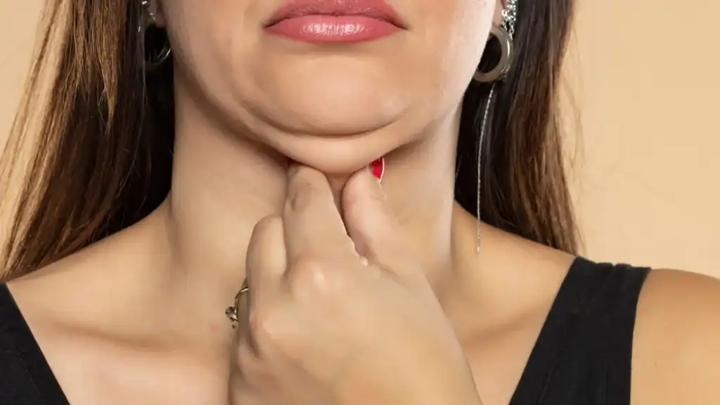 An image of a woman with double chin, sad, worried : Non Surgical Double Chin Removal Treatment in Selston, UK
